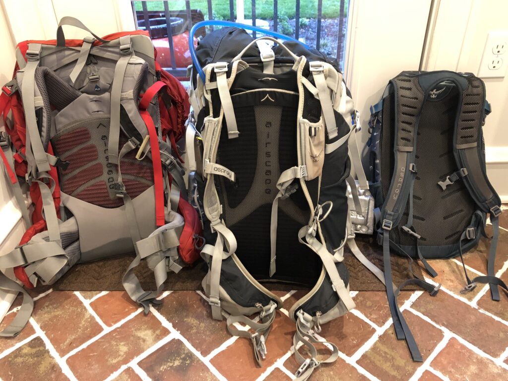 three packs, two for backpacking and one for day hiking